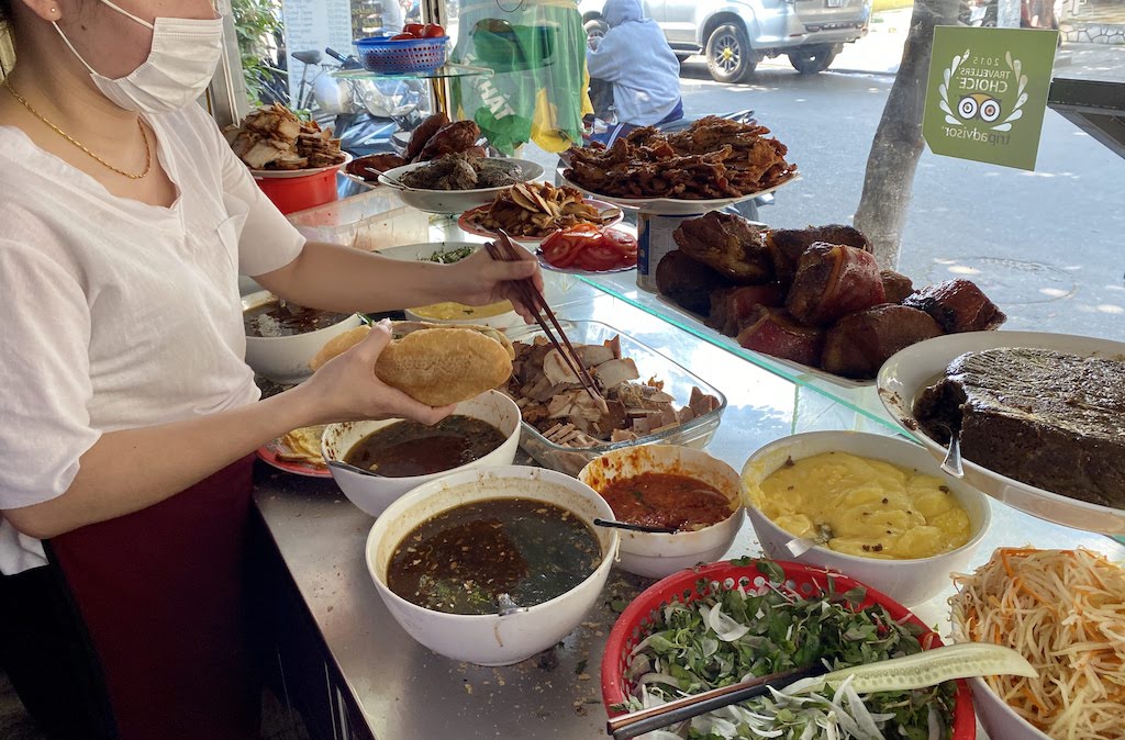 preparing banh mi sandwich